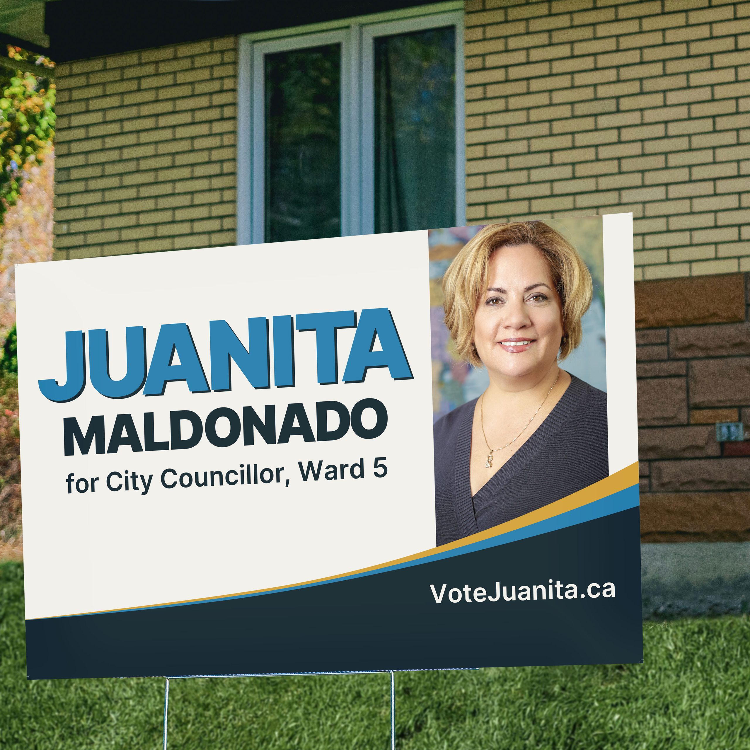 neighbourhood home with Juanita's Sign on their lawn showing public support